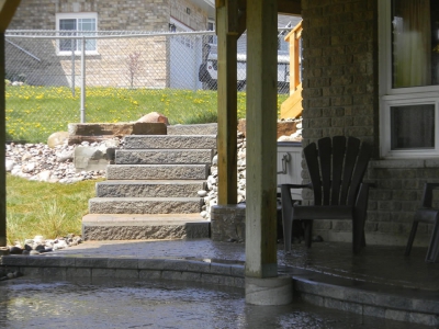 Walkout basement with Sienna steps, interlock patio and natural stone