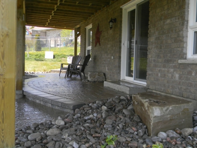 Walkout basement with Sienna steps, interlock patio and natural stone