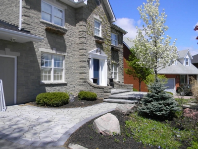 Entrance with Mega Arbel paver and raised landing and ornamental pear tree