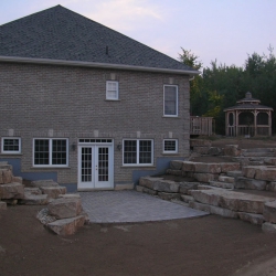 Walkout basement with limestone tiered retaining walls