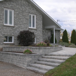 Entrance with tiered retaining walls