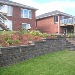 Step down retaining wall