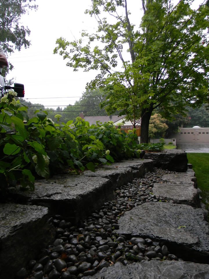 Limestone with river stone retaining wall