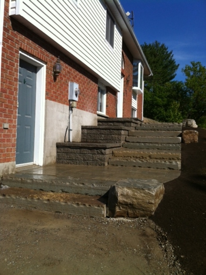 Natural Stone steps and terraced planter walls