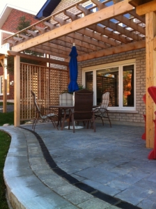 Stone patio and Cedar Arbour with privacy screen